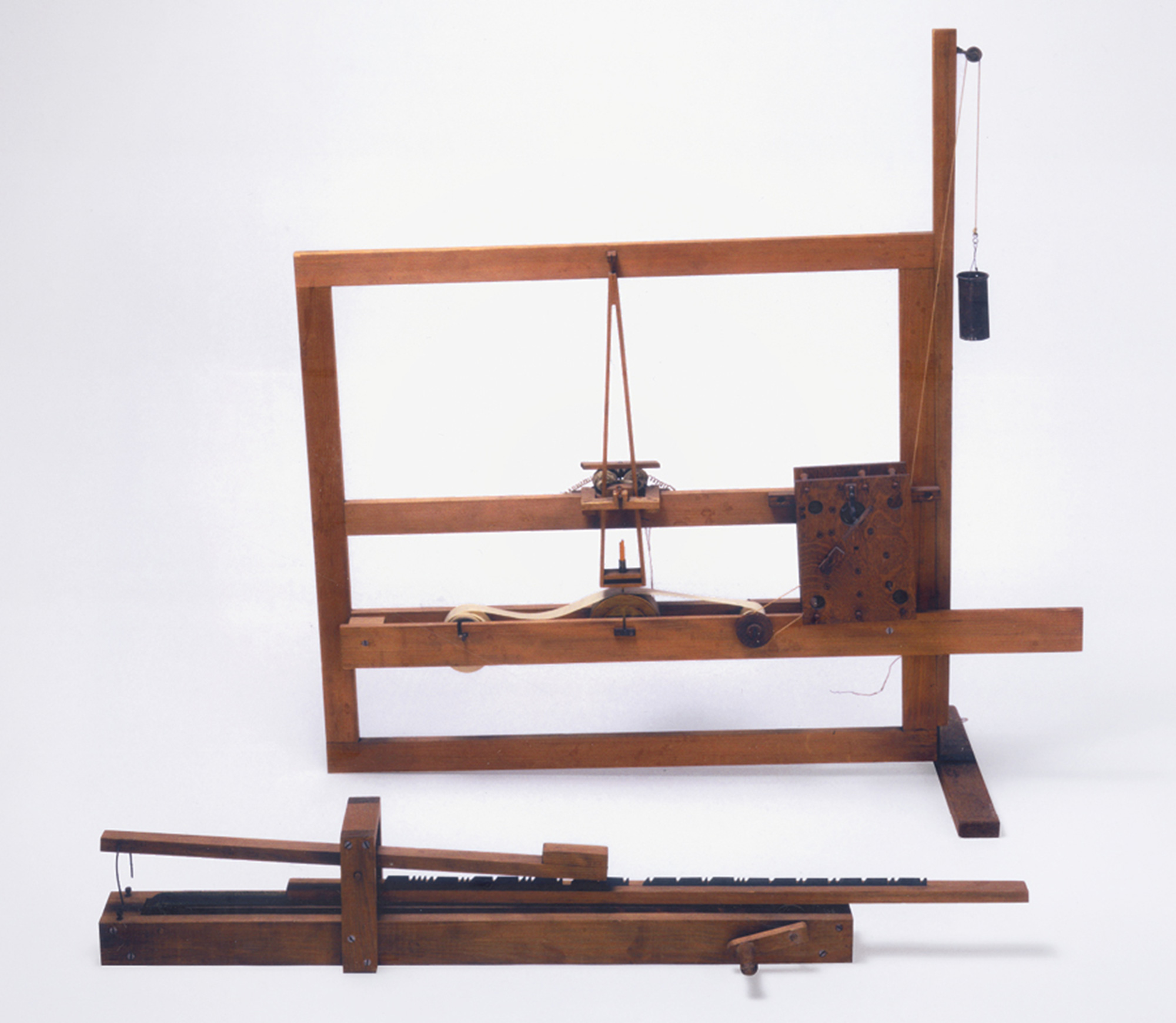 A photograph of a replica of Morse’s first telegraphic device, circa eighteen thirty-five.