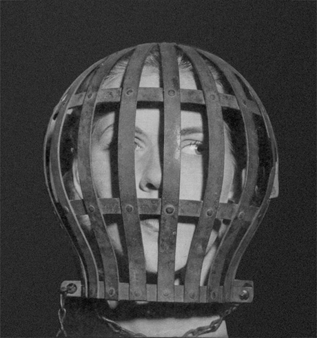 “A photograph of a woman’s head in a cage from a nineteen forty-three issues of “Lilliput” magazine. The device is used to train undergraduates off solids. A knob at the back sets the bars closer and closer together until finally the head is encased by fine mesh and soup is the only food that can pass through.
“
