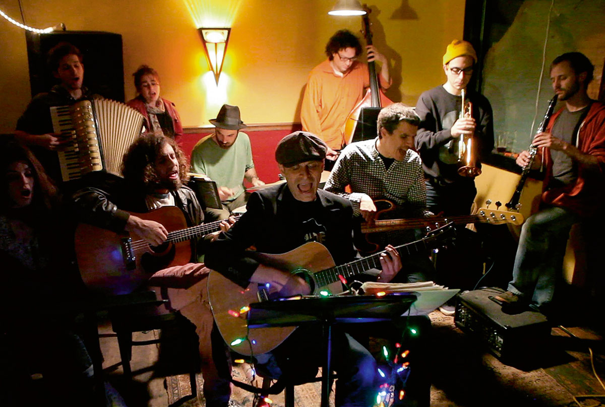 A photograph of Tim Davis and friends performing “Speed of Light.”