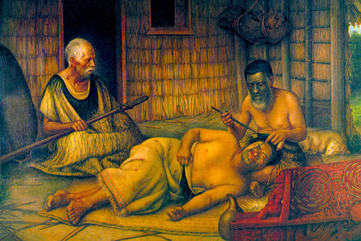 Gottfried Lindauer’s late-nineteenth century painting of a Maori man being tattooed. Before beginning his work, the tohunga-ta-moko (the tattooer) would study the face and decide which features to accentuate. The design was first traced in charcoal before permanent marks were made using a chisel of sharp obsidian or bone.
