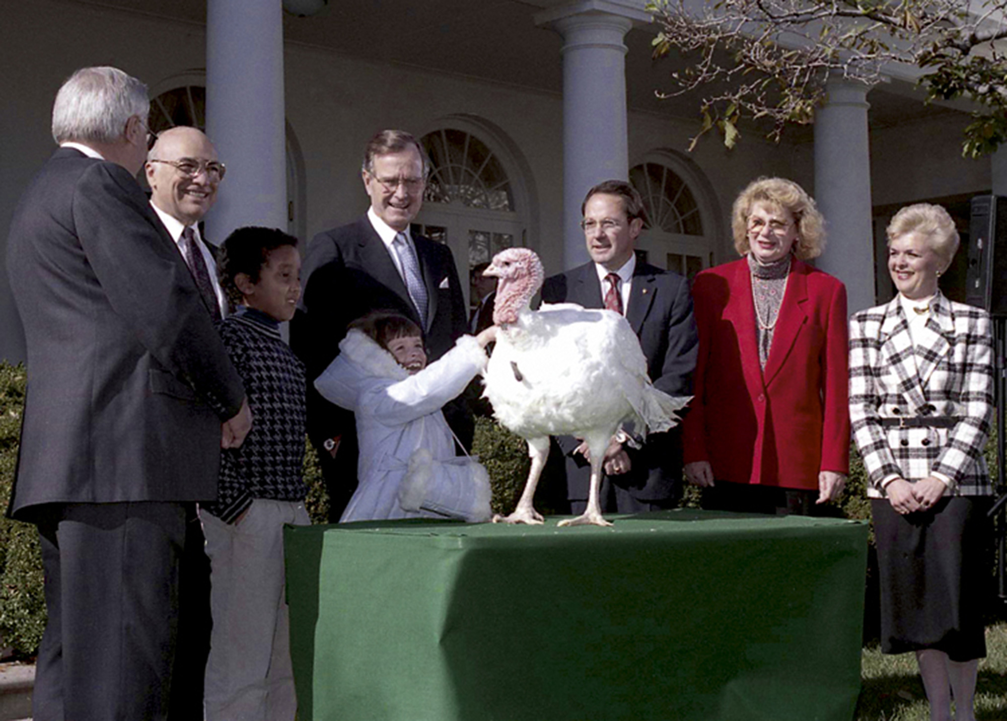 A 17 November nineteen eighty-nine photograph of George H. W. Bush pardoning the first turkey.