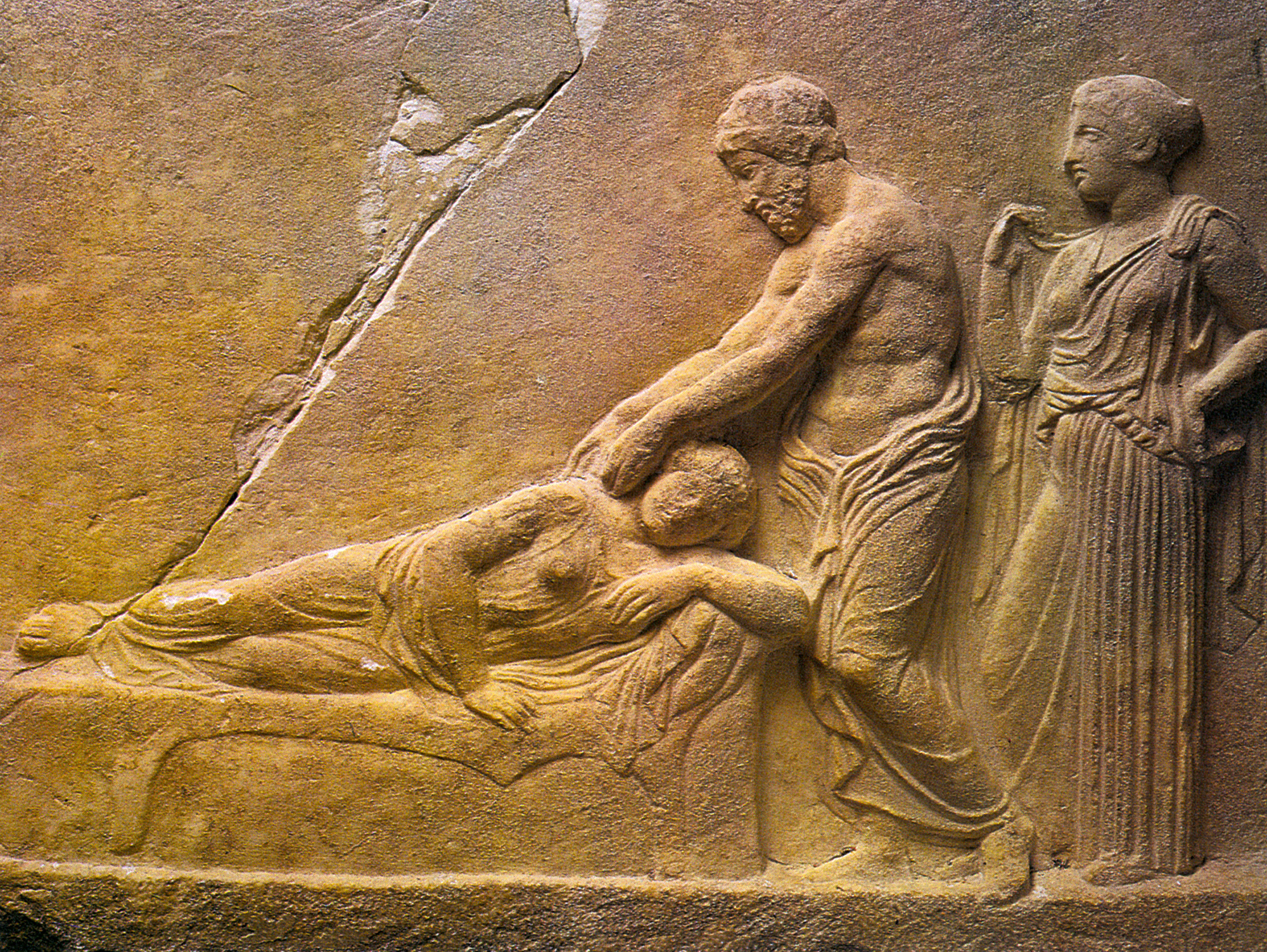 Relief votive of Asclepius and Hygieia tending to a sick woman, fourth century BCE.