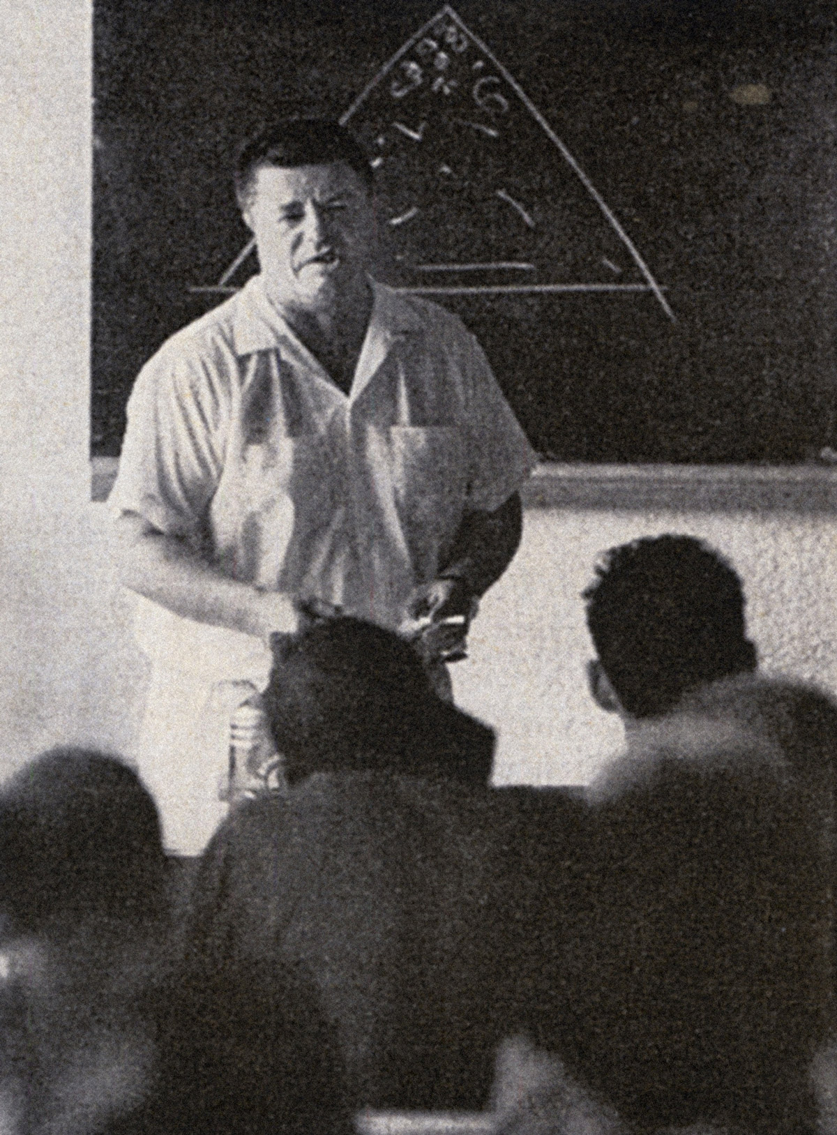A nineteen sixty-two photograph of Chuck Dederich lecturing at a Synanon meeting.