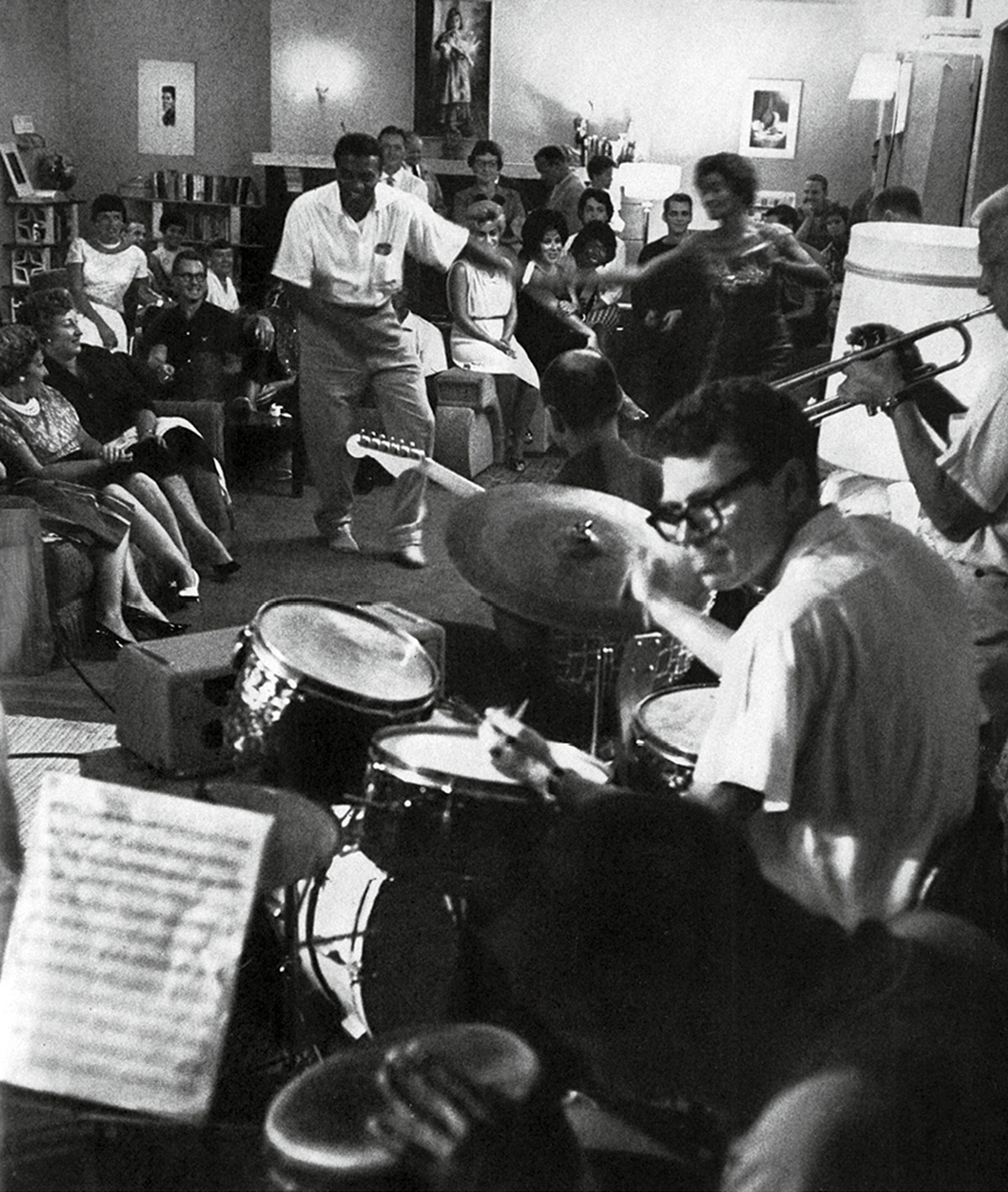 A nineteen sixty-two photograph of Synanon’s house band playing for members and guests. Over the years, the group included numerous celebrated musicians, including guitarist Joe Pass.