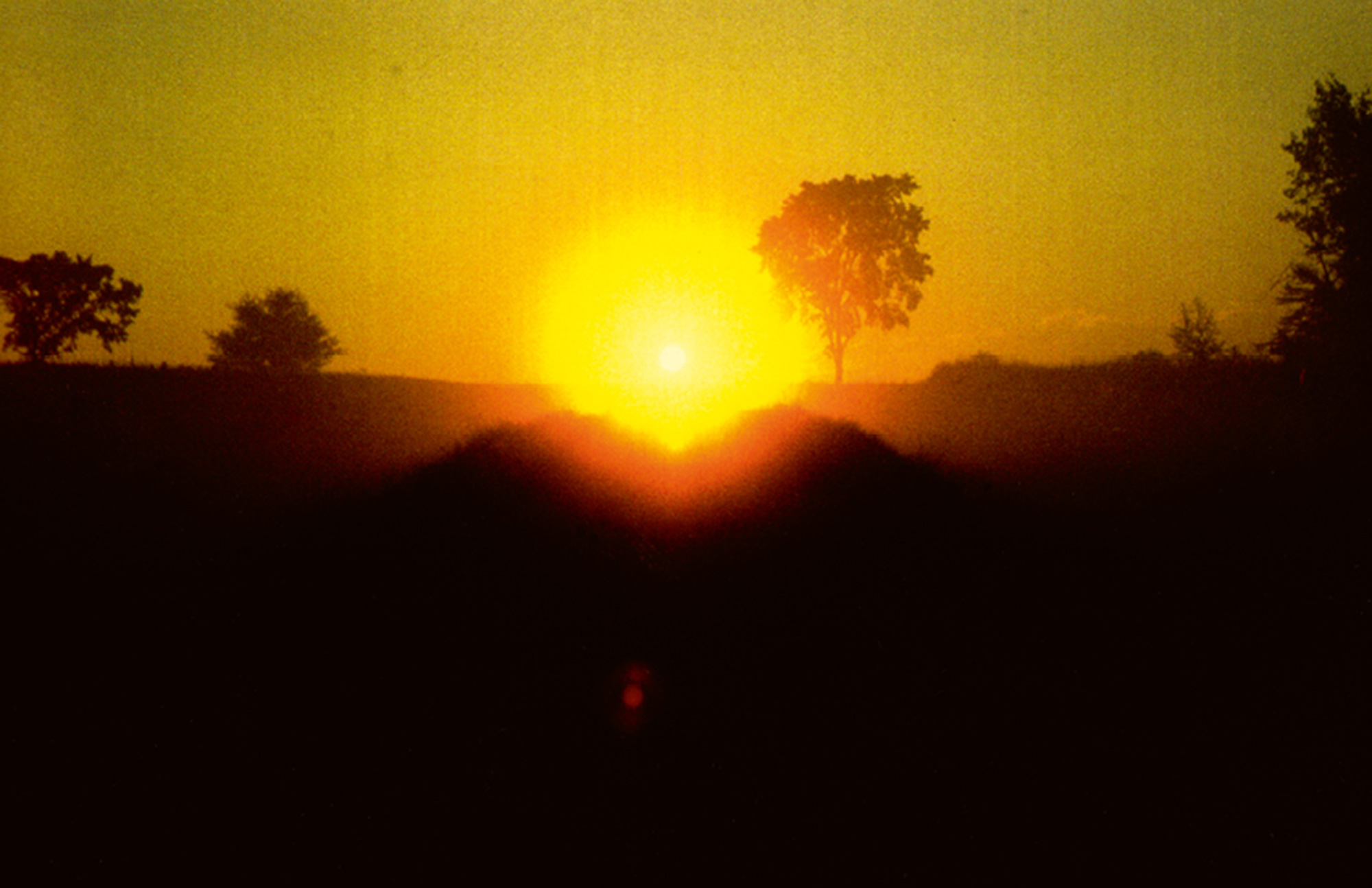 A blown-out photograph of a sunset. James Pierce’s “Earthwoman” was designed so that rays of the sun on the morning of the summer solstice would align with the cleft in her buttocks.