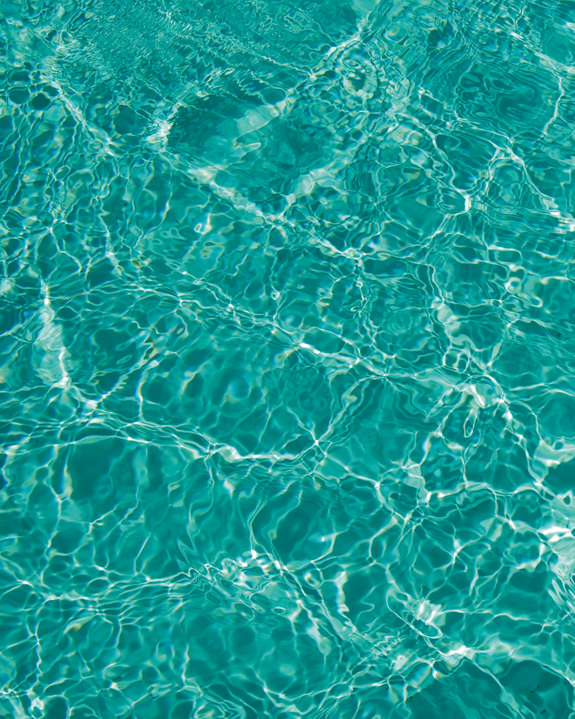 An abstract twenty twelve photograph of turquoise water by Misha Kahn.