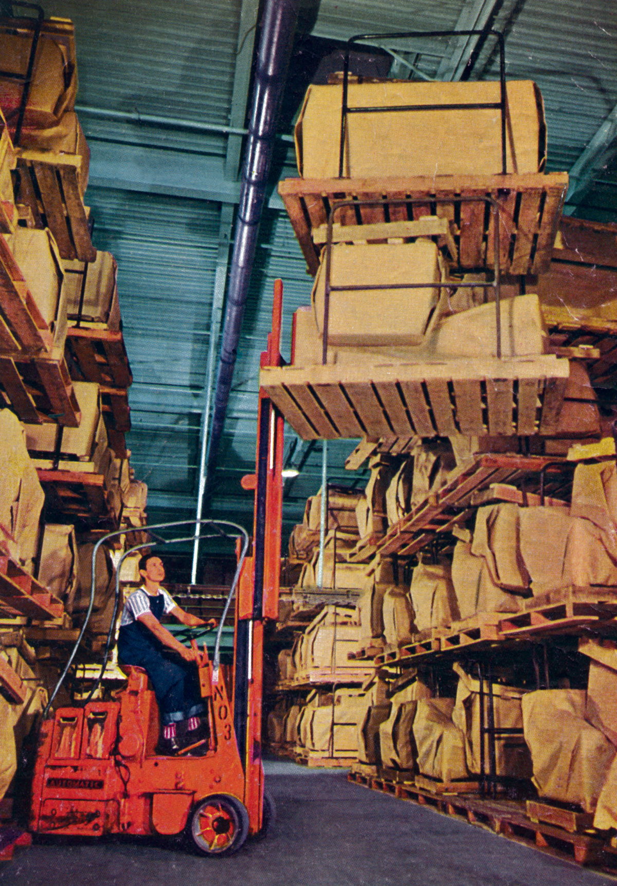 A photograph of a forklift operator moving goods using wooden pallets at a Salt Lake City warehouse.