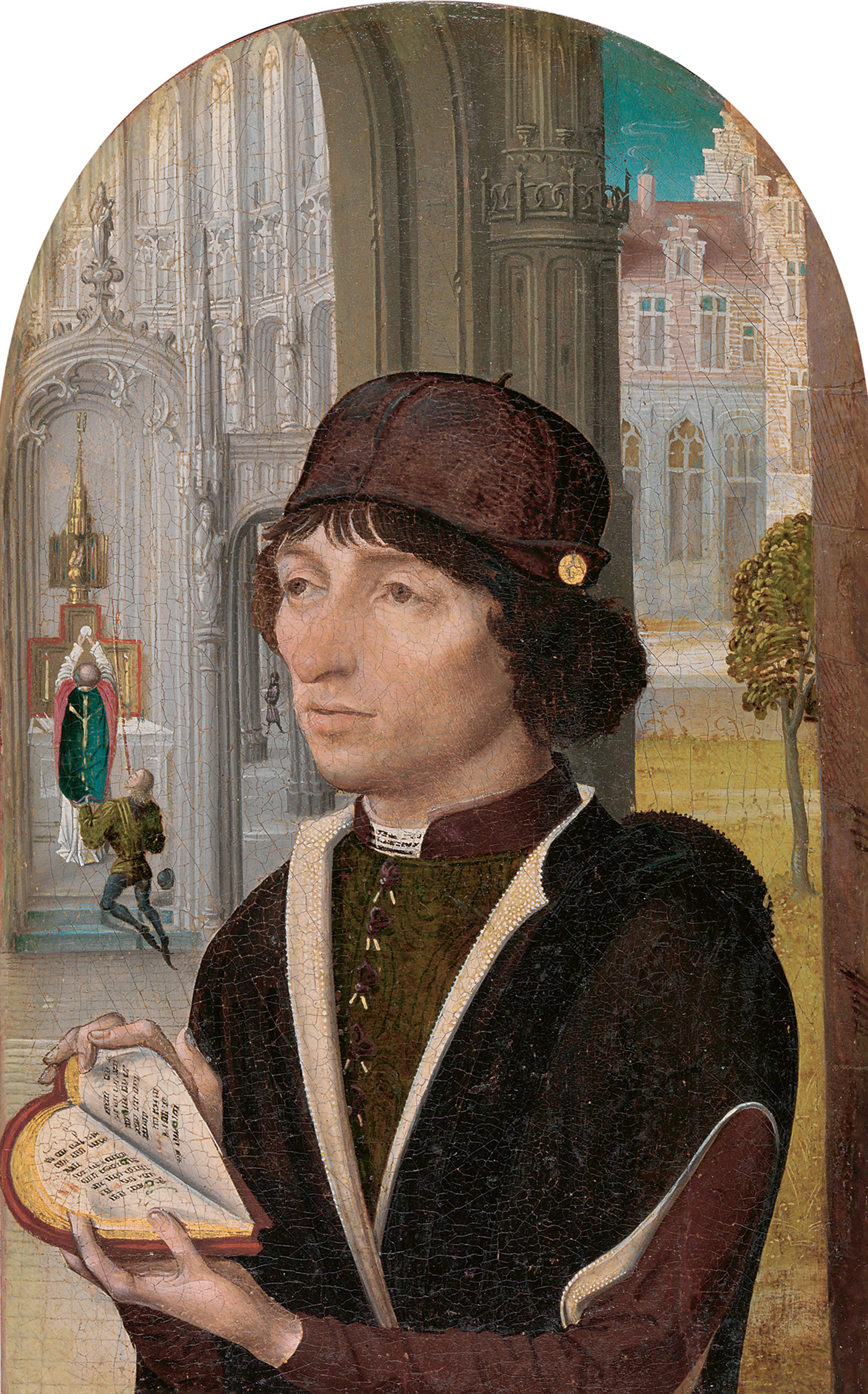 A circa fourteen eighty painting by the Master of the View of Sainte Gudule, titled “Young Man Holding a Book.” The book at hand is notably heart-shaped when opened.