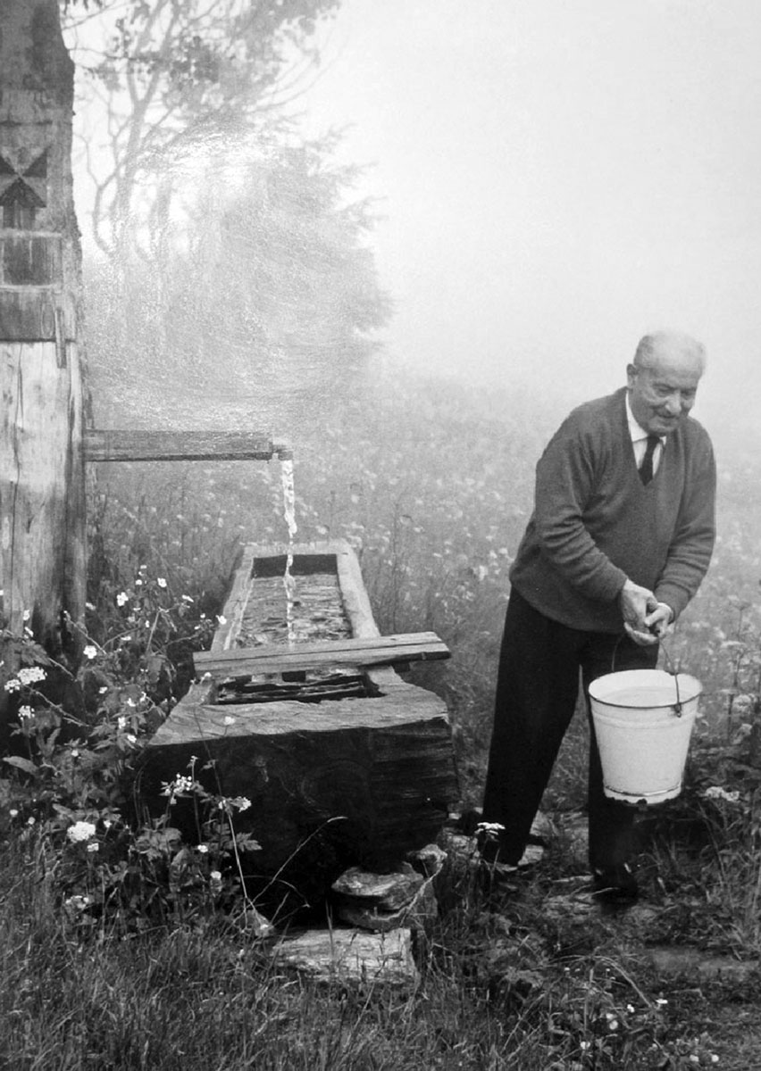 Undated photograph of Heidegger outside his hut in the Black Forest.
