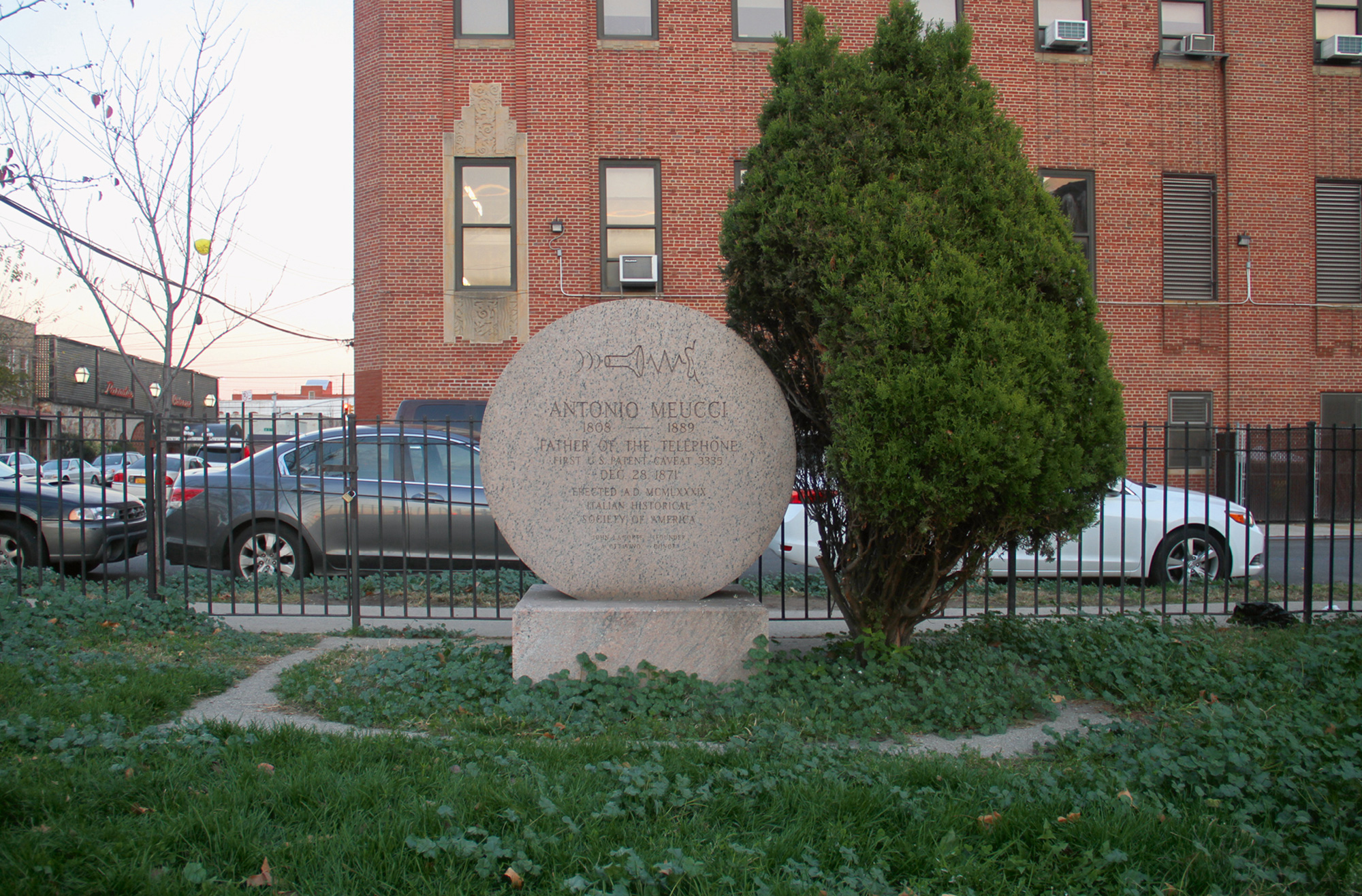 A photograph of the memorial to Antonio Meucci, Meucci Triangle, in south Brooklyn.