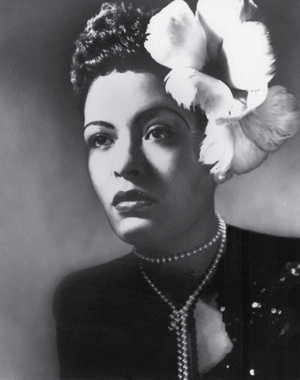 A circa nineteen thirty six photograph of Billie Holiday.