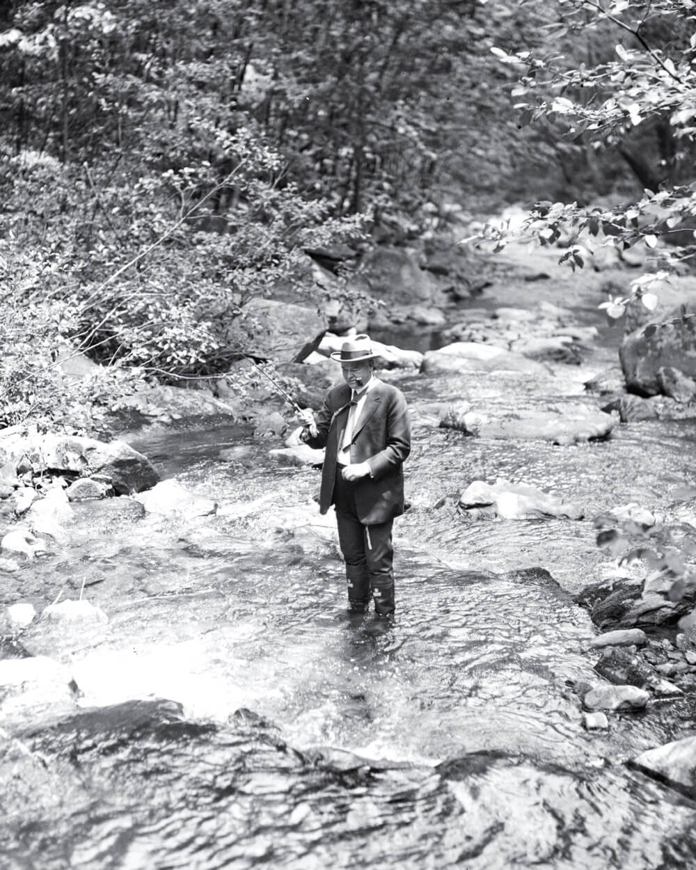 A nineteen thirty six photograph of Herbert Hoover fishing.