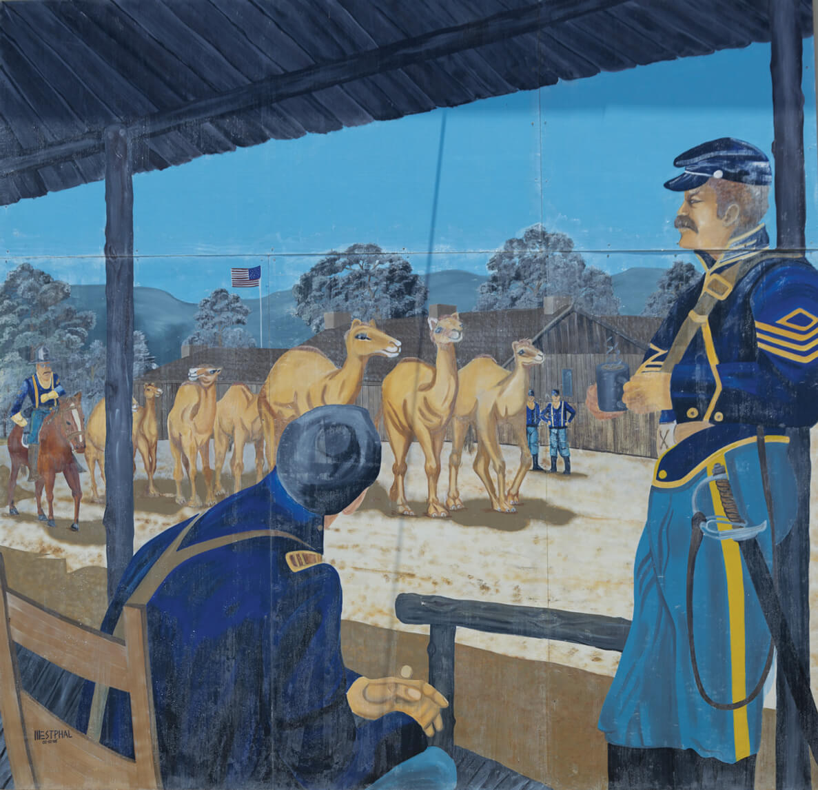 A photograph of a mural depicting the arrival of the Camel Corps at the American Army's Camp Verde in Texas.