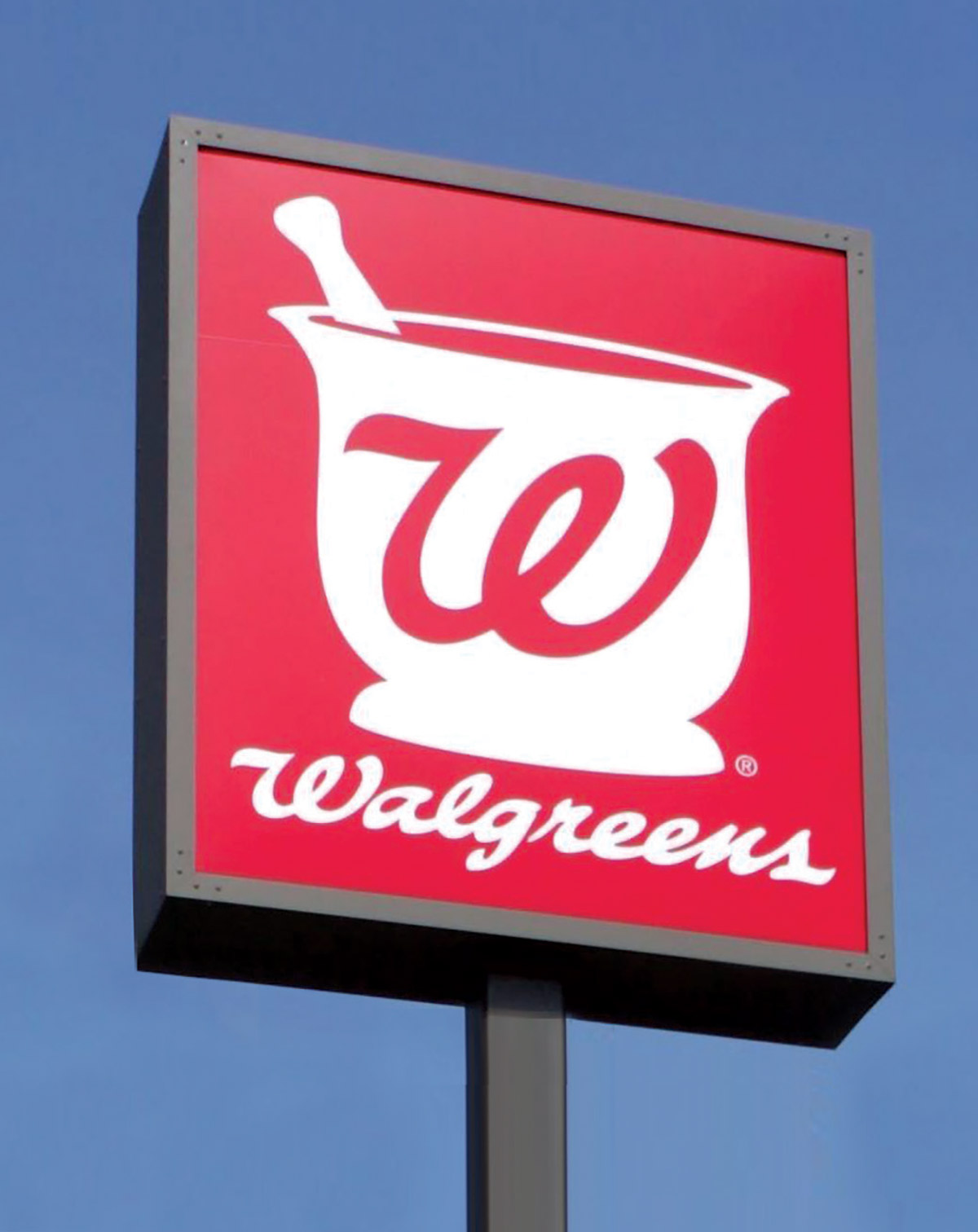 A photograph of a Walgreens sign with a mortar-and-pestle logo.