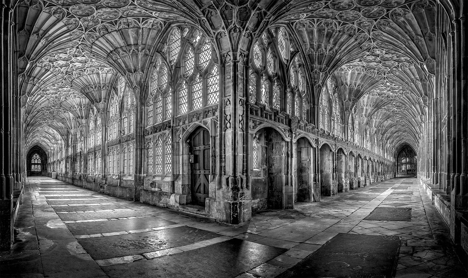The cloisters at Gloucester Cathedral. Built between 1351 and 1357, likely under the direction of Thomas de Cantebrugge, they feature the earliest known example of fan vaulting.