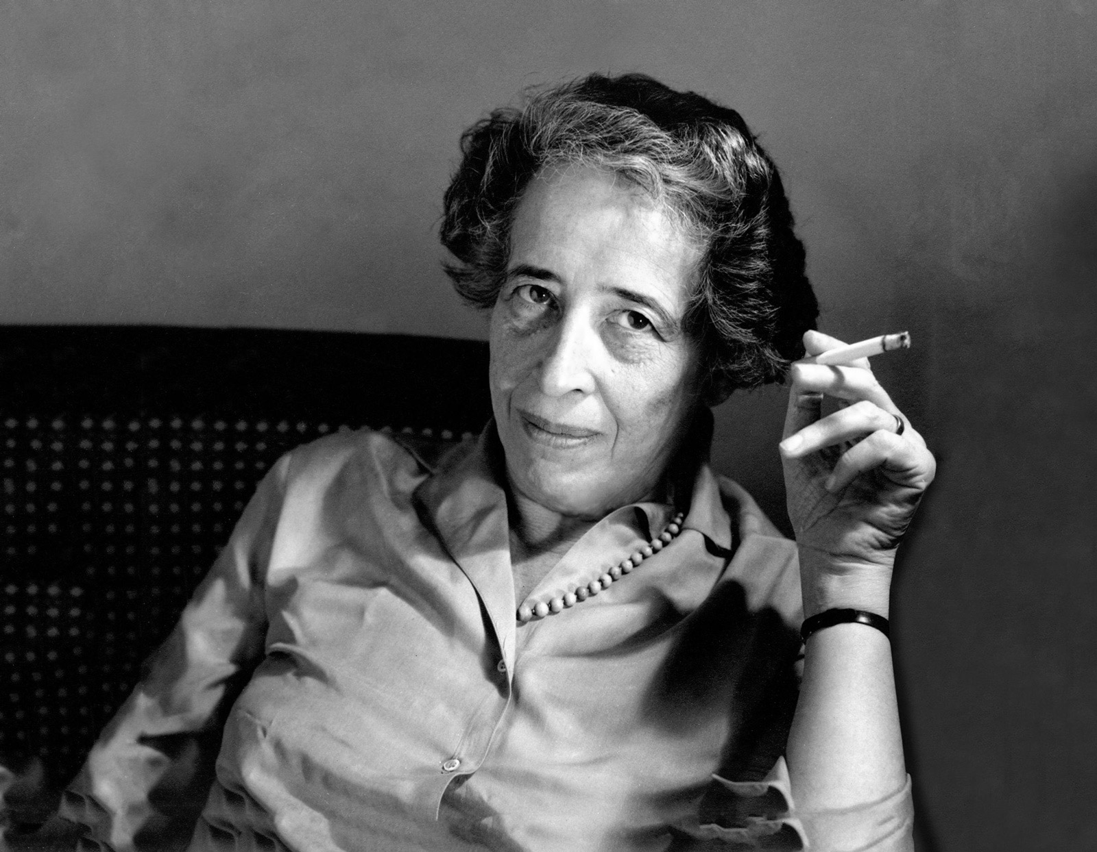 An undated photograph of Hannah Arendt smoking a cigarette.