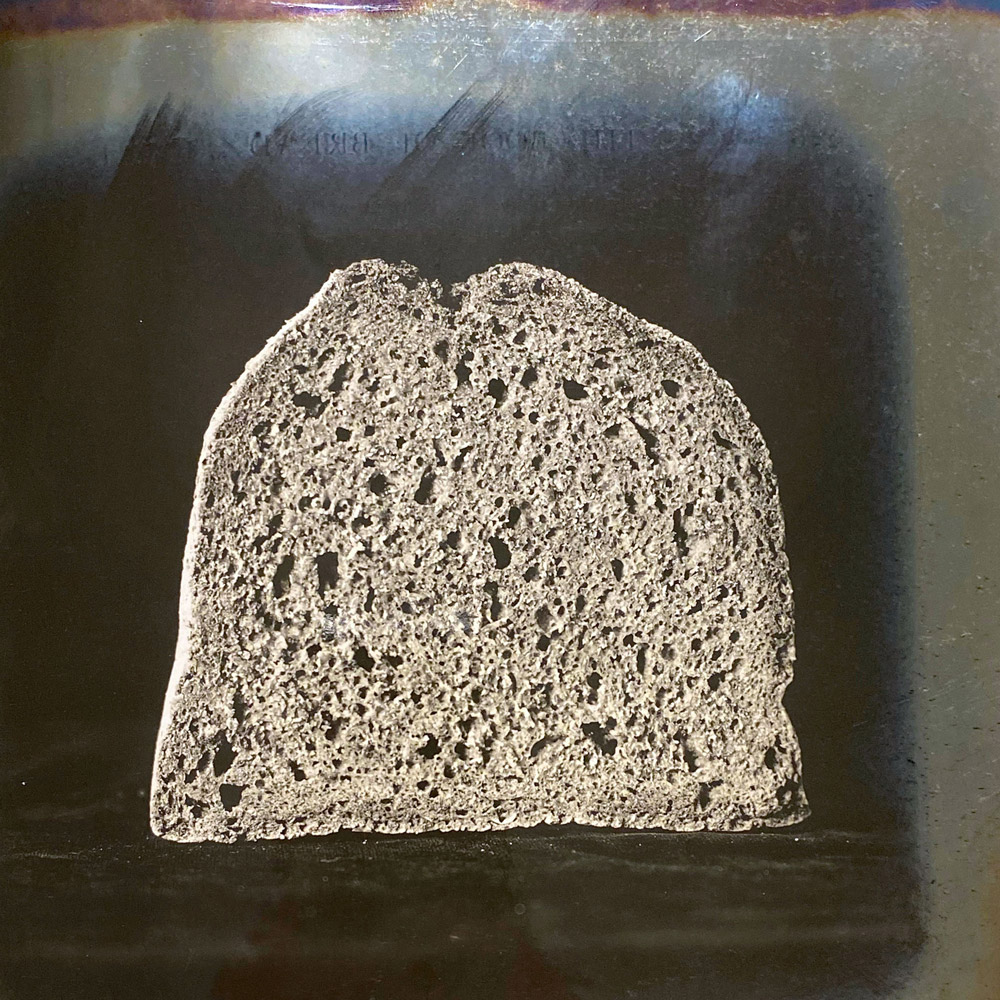 A photograph from Owen Simmons’s “The Book of Bread” depicting, according to the original caption, a section of “the usual wheatmeal loaf supplied by a gentleman of distinction doing a first-class family trade.”