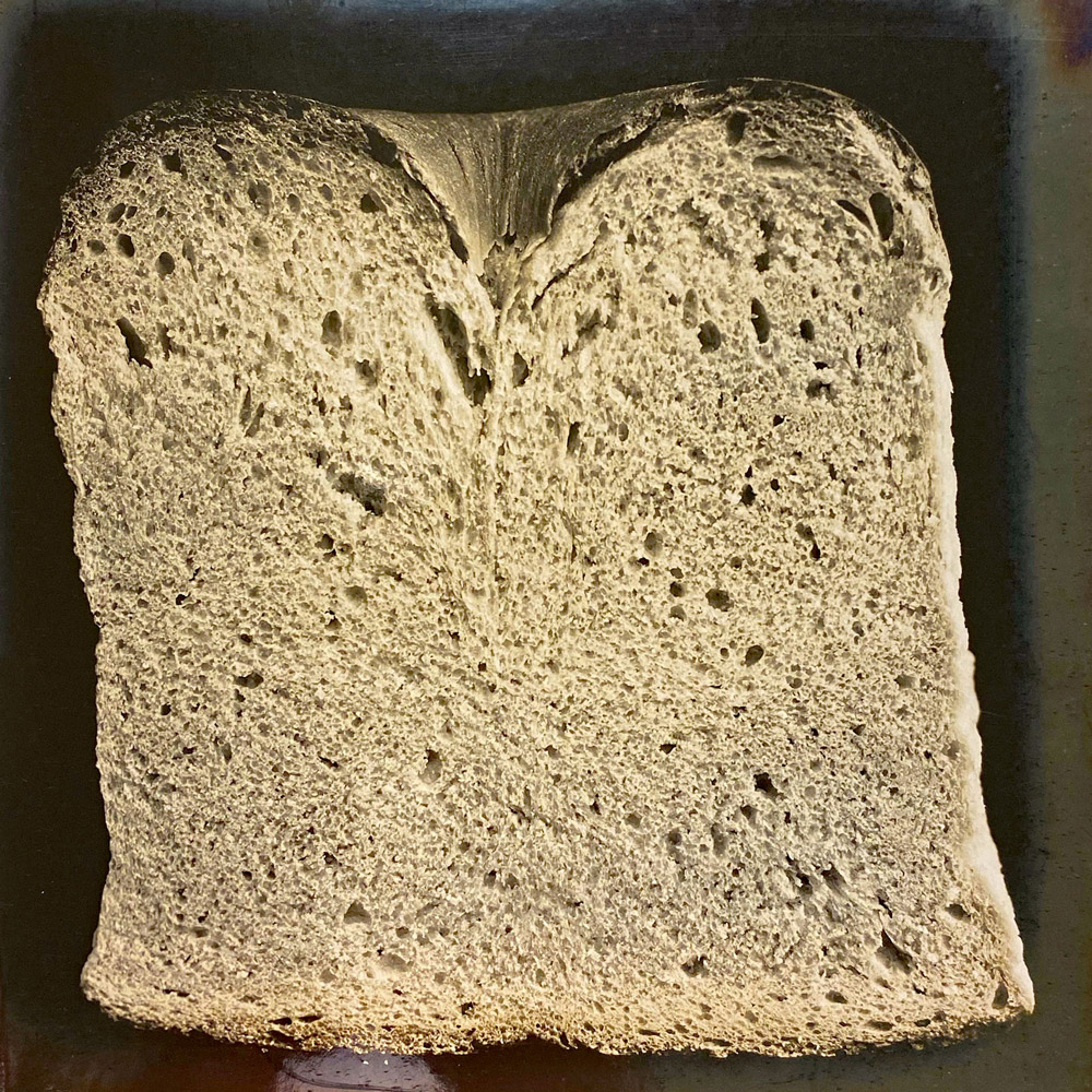 A photograph from Owen Simmons’s “The Book of Bread” depicting, according to the original caption, a section of “a prize English crumby loaf from Liverpool”