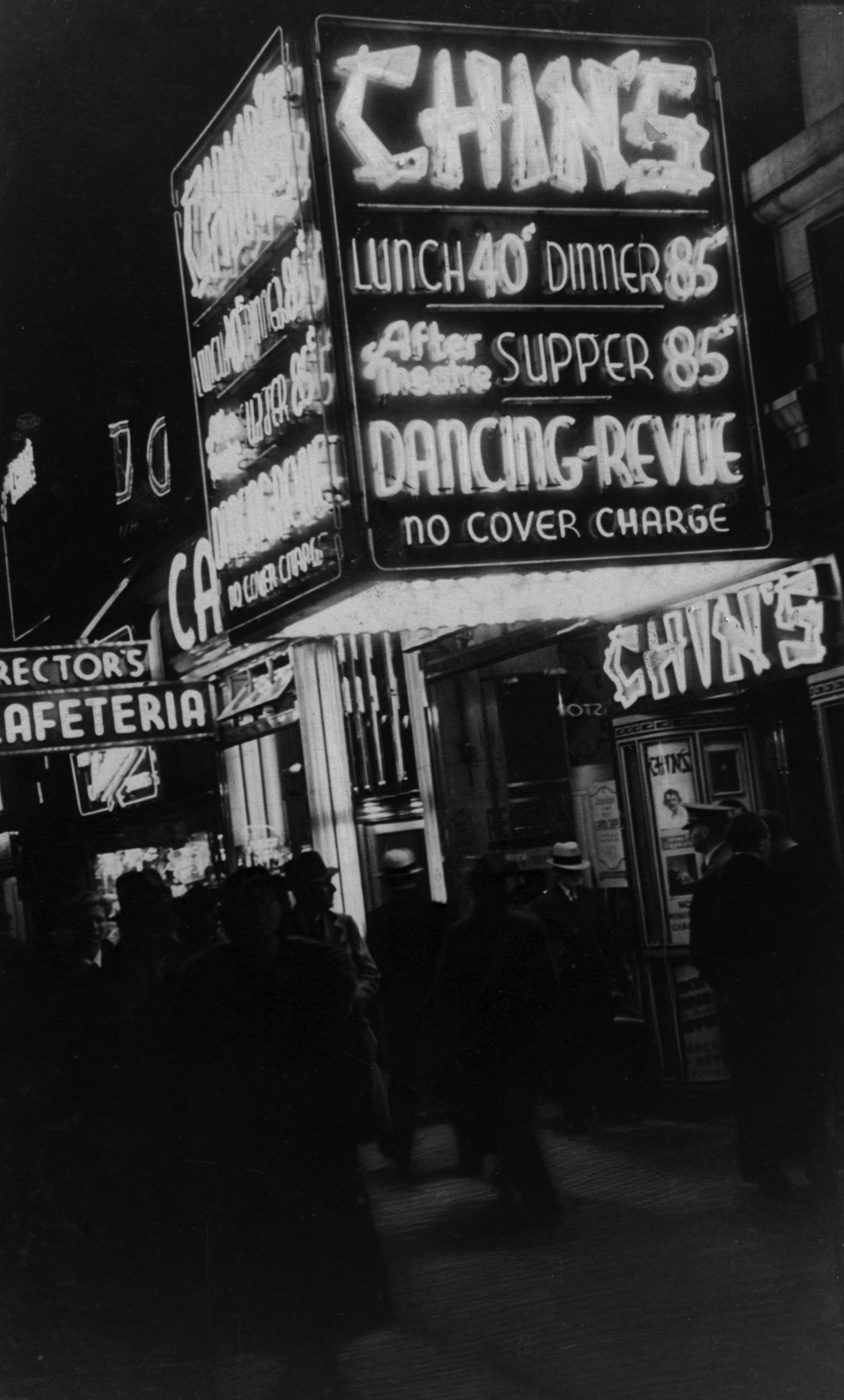 Photograph by Ilf of a neon sign advertising dining and a dancing-revue, circa nineteen thirty-five.