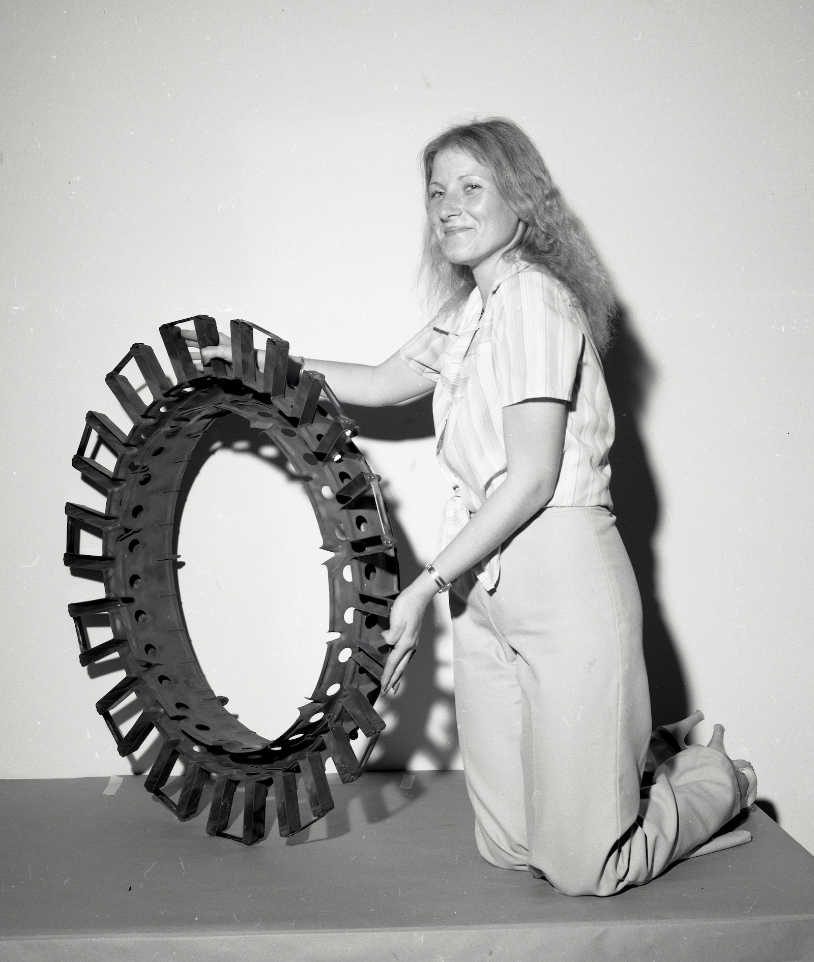 Nineteen seventy-nine photograph by Donald Huebler of a woman holding a partial flameholder.
