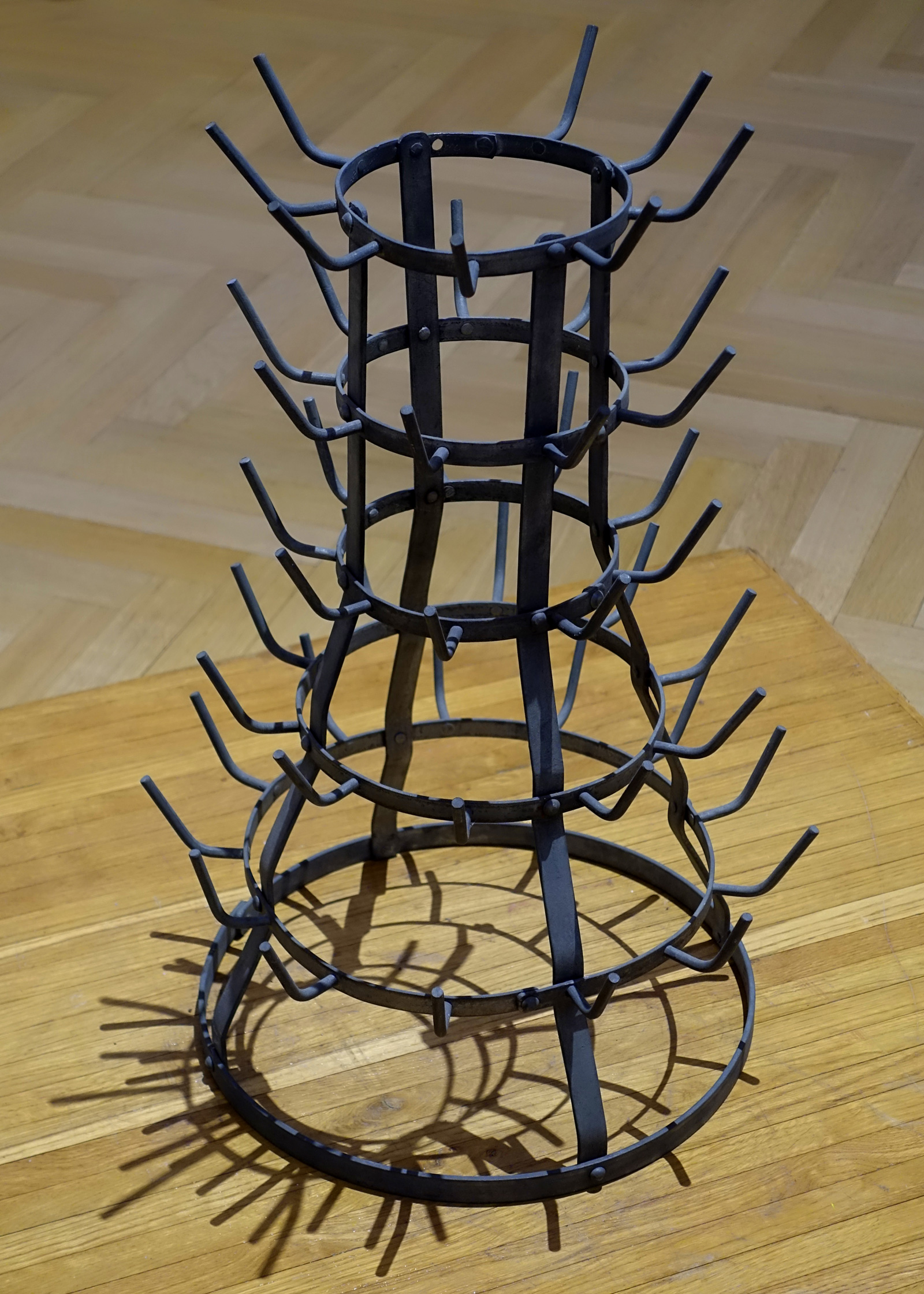 Photograph by Bill Bowles of a basket type gutter flameholder from nineteen forty-eight.