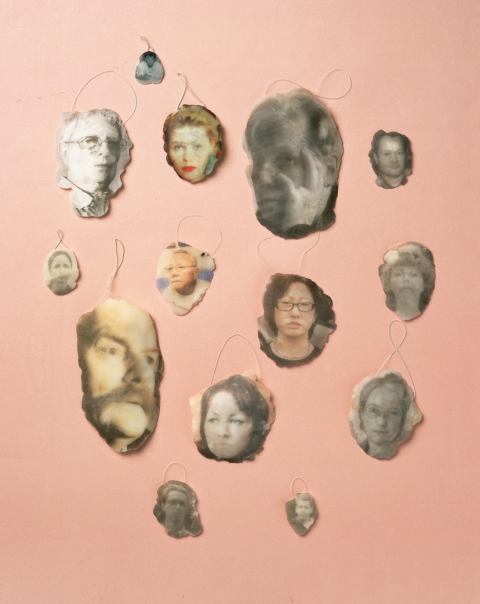 Wax medalions featuring images of disappointed and offended people made by artist Magnus Bärtås.