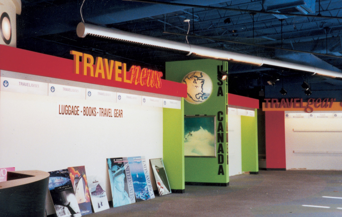 A photograph of the empty interior of an abandoned travel agency.