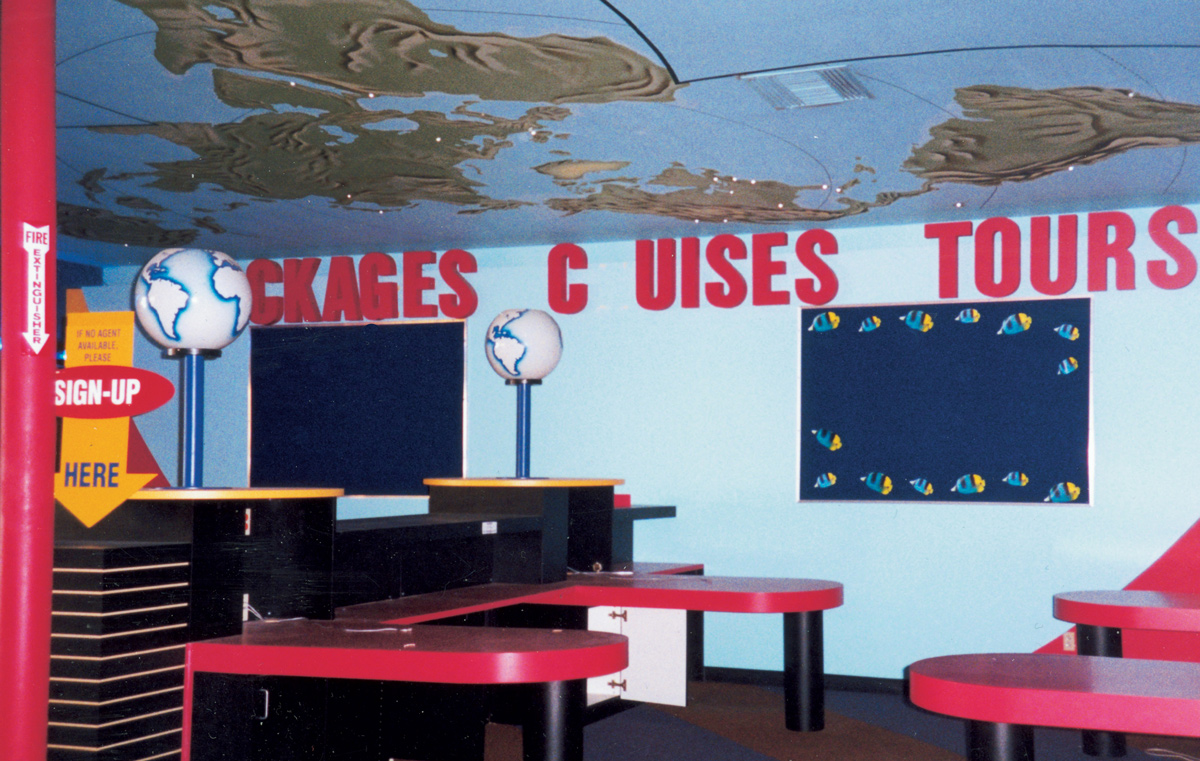 A photograph of the empty interior of an abandoned travel agency.
