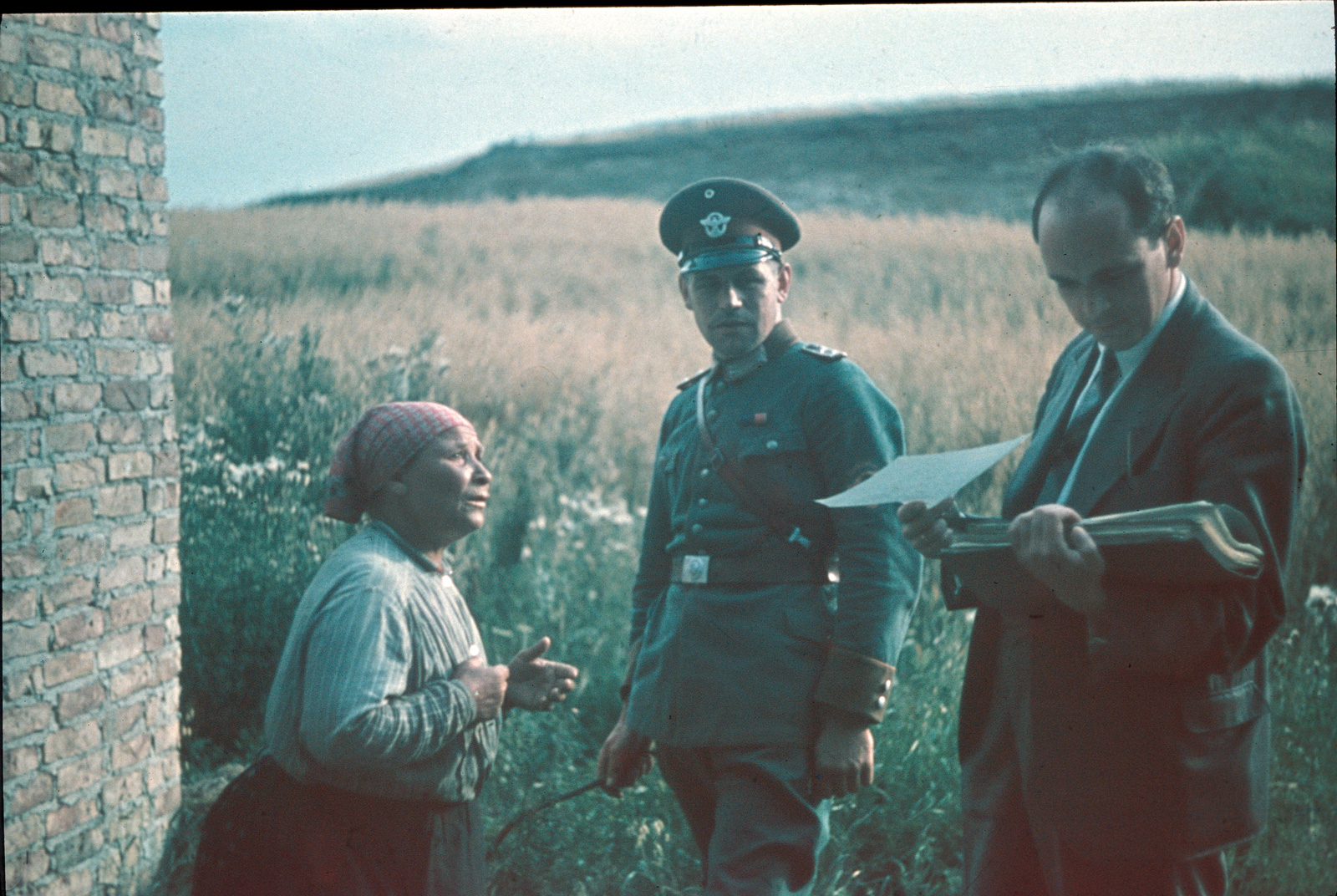 Nazi racial theorist Robert Ritter and a soldier interrogating a Romani woman.
