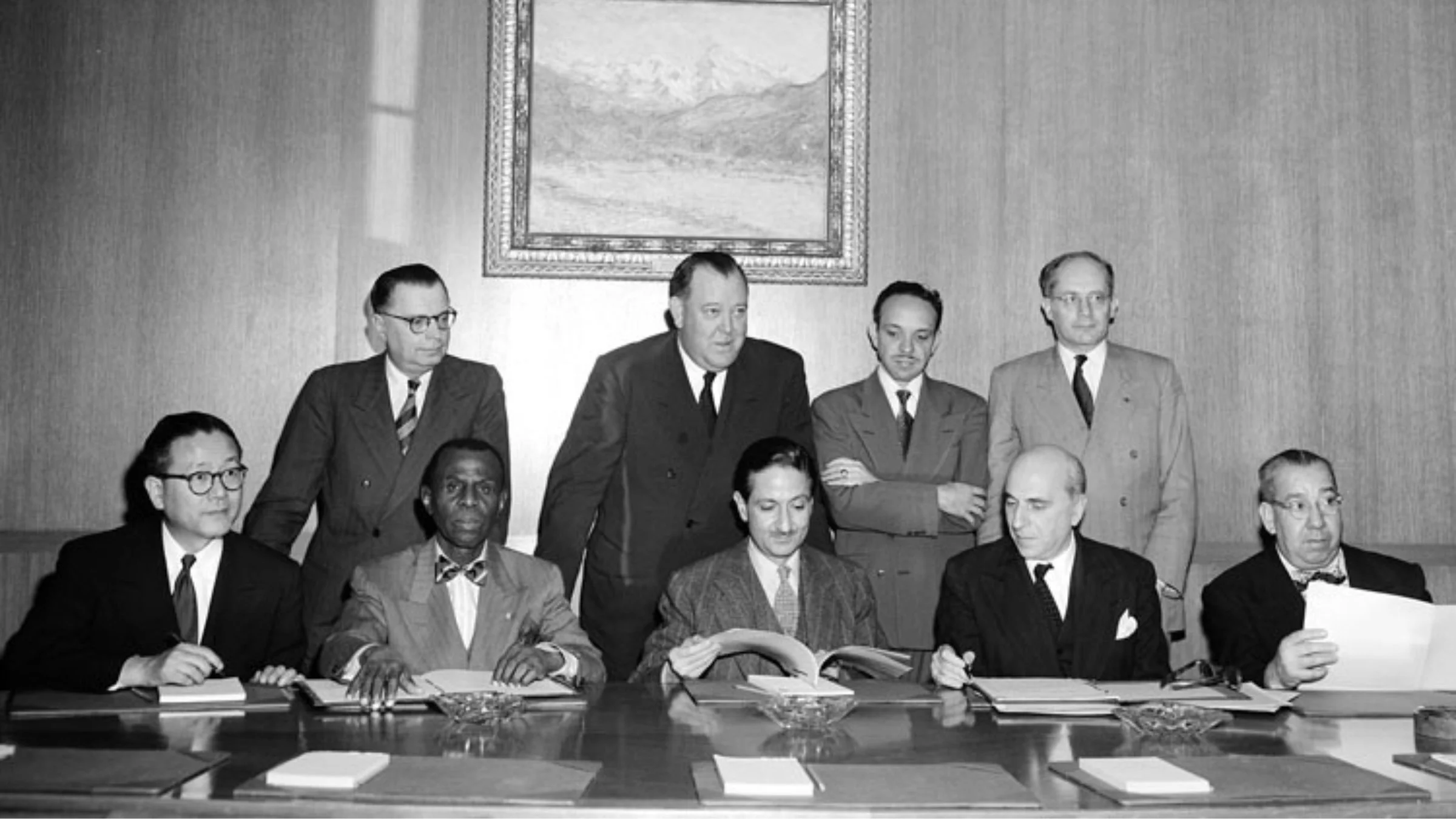 Photograph of representatives from Korea, Haiti, France, and Costa Rica adding their signatures to the Convention on the Prevention and Punishment of the Crime of Genocide at the United Nations on fourteen October nineteen fifty.