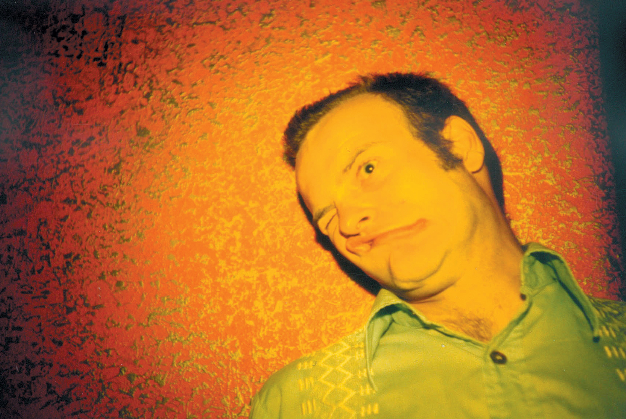 A Lomographic image depicting a man making a funny face.